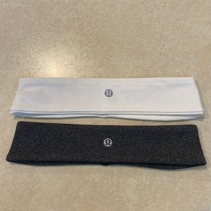 2 Lululemon headbands: one white, one dark gray/charcoal.